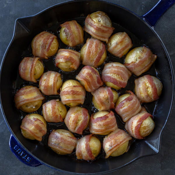 Bacon Wrapped Potatoes on a baking dish.