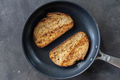 Bread toasting on a pan.