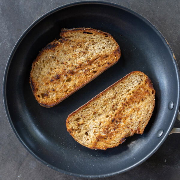Bread toasting on a pan.