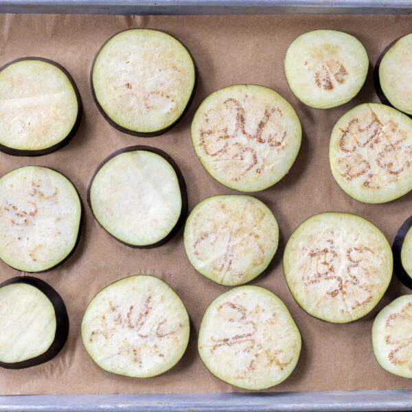 Eggplant pieces on a baking sheet.