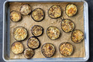 Roasted eggplant on a baking sheet.