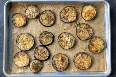 Roasted eggplant on a baking sheet.