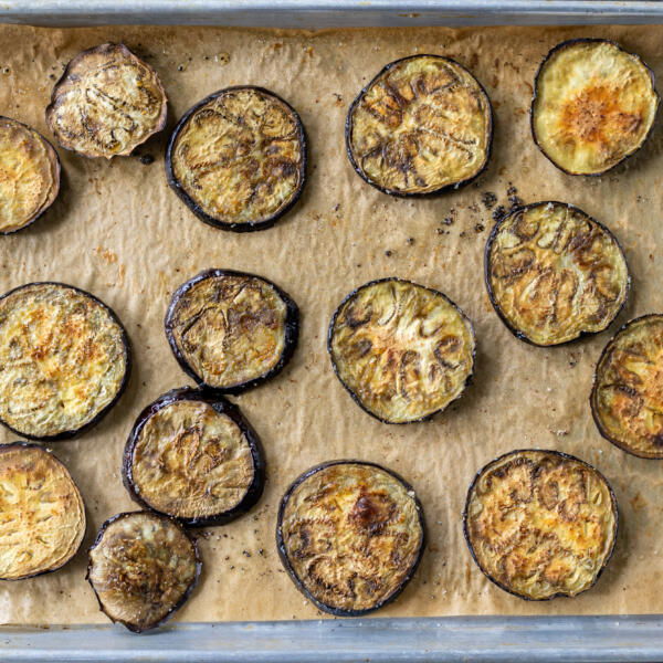 Roasted eggplant on a baking sheet.