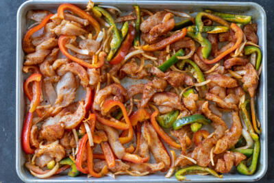 Chicken Fajitas on a sheet pan before baking.