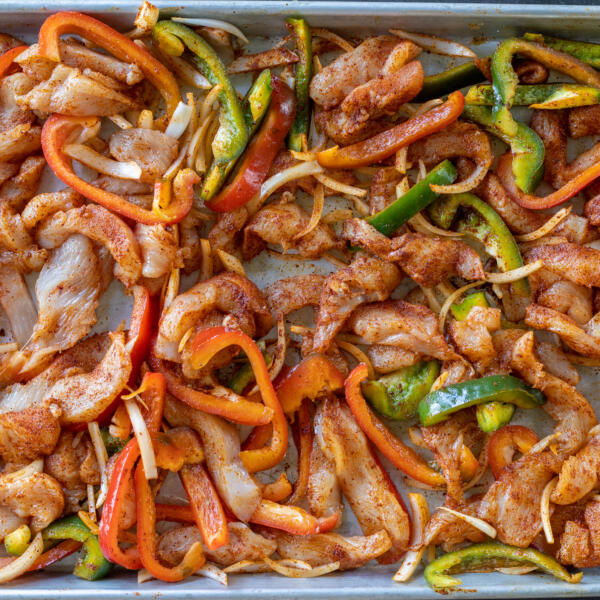 Chicken Fajitas on a sheet pan before baking.