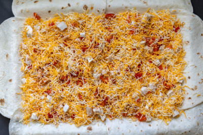 Tortillas on a sheet pan with a filling.