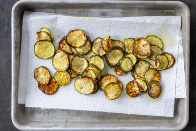 Fried zucchini on a paper towel.