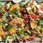 Sheet Pan Nachos with different toppings.