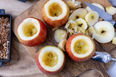 Scooped out apples on a trya.