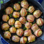 Bacon Wrapped Potatoes on a baking pan.
