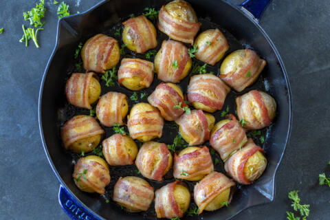 Bacon Wrapped Potatoes on a baking pan.