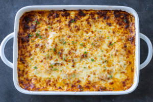 Baking pan with baked Eggplant Lasagna .