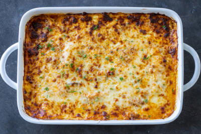 Baking pan with baked Eggplant Lasagna .