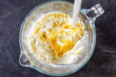 Cheese sauce in a cup.