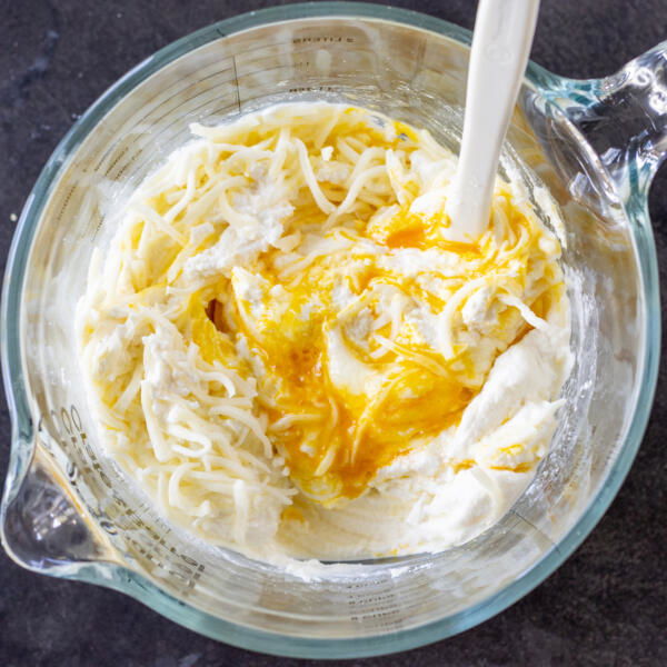 Cheese sauce in a cup.