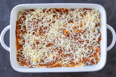 Meat and cheese sauce in a baking pan.