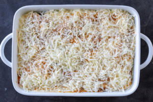 Eggplan lasagna in a pan before baking.