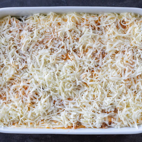 Eggplan lasagna in a pan before baking.