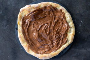 Pizza crust with nutella on top.