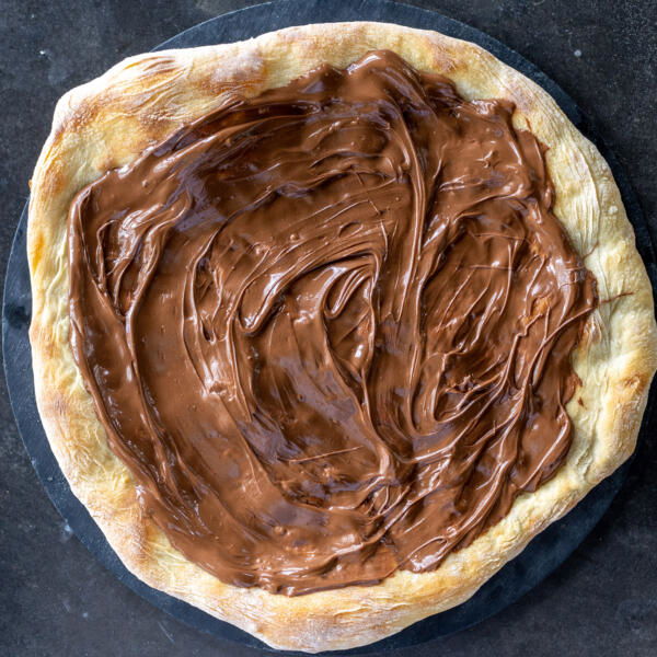 Pizza crust with nutella on top.