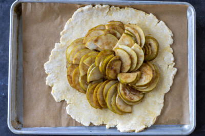 Crust and pears on a baking sheet.