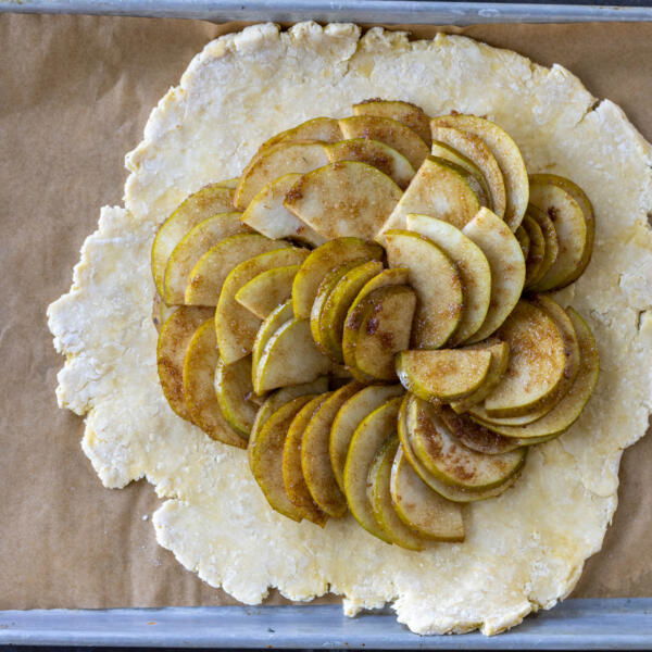 Crust and pears on a baking sheet.