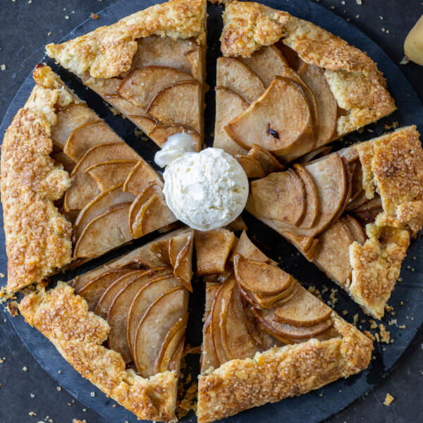 Sliced up Pear Galette with ice cream.