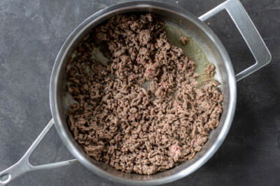 Cooked ground beef in a pan.