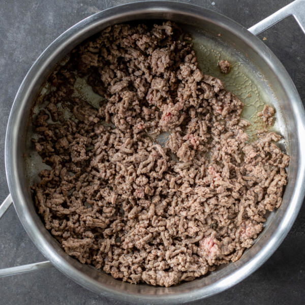 Cooked ground beef in a pan.