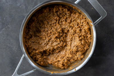 Beef with beans in a pan.