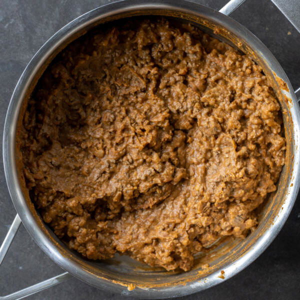 Beef with beans in a pan.