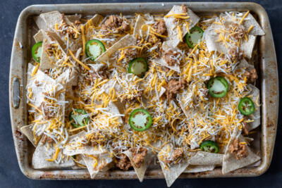 Sheet Pan with chips, cheese and beef mixture.