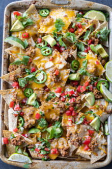 Sheet Pan Nachos with different toppings.