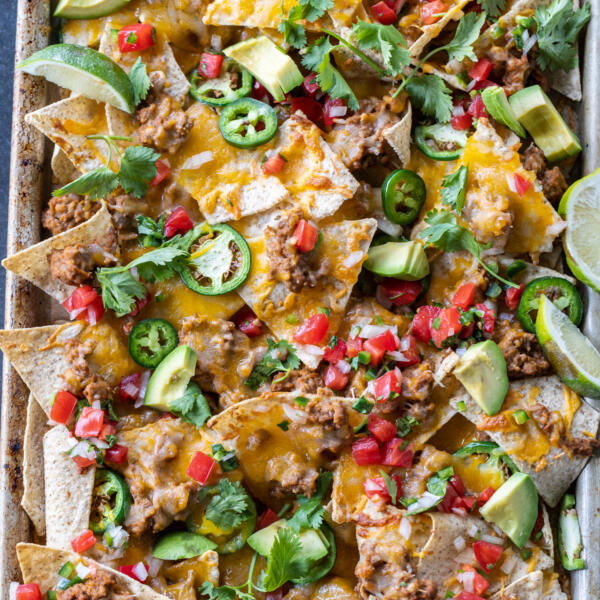 Sheet Pan Nachos with different toppings.