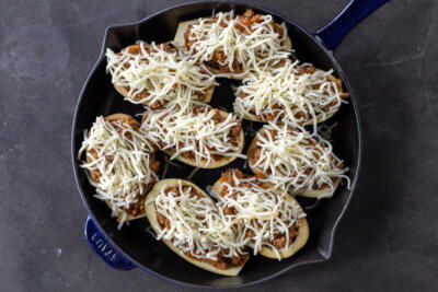 Stuffed Eggplant with cheese on top before baking.