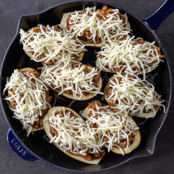 Stuffed Eggplant with cheese on top before baking.