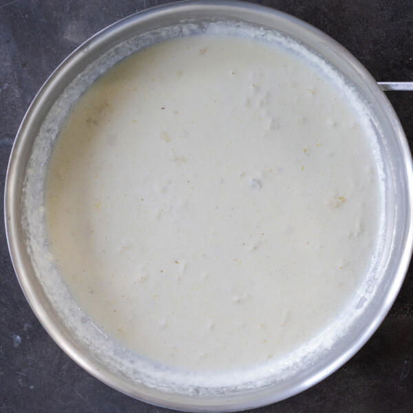 Alfredo sauce in a pan.