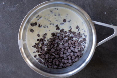 Chocolate chips and heavy cream in a pan.