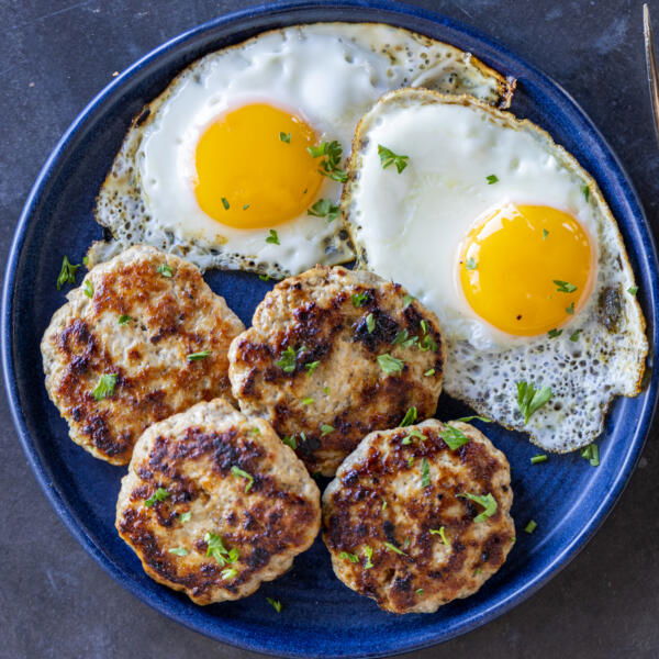 Plated Homemade Sausage Patties with eggs.