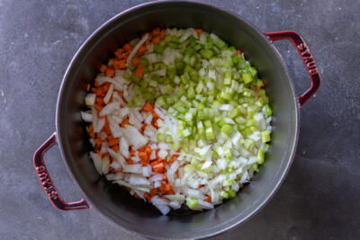 A pot with veggies cooking.