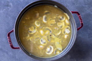 Broth, barley, mushroom and veggies cooking.