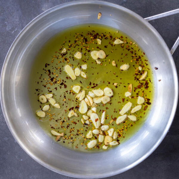 Oil with garlic and pepper in a pan.