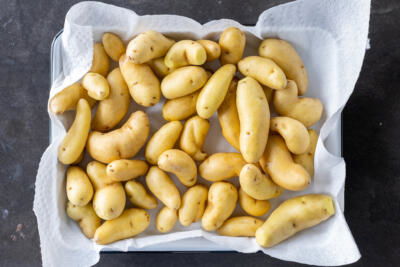 Washed potatoes on a paper towel.