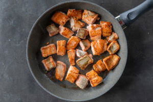 Browned salmon on pan.