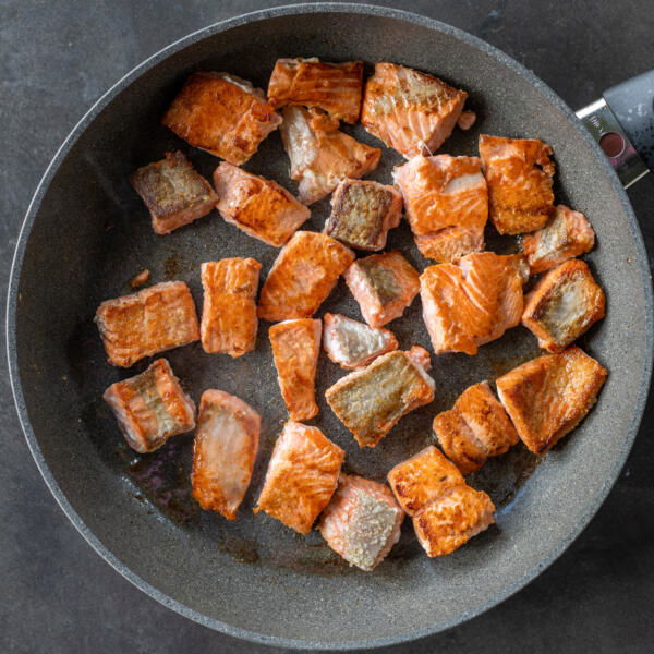 Browned salmon on pan.