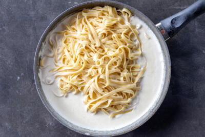 Sauce with pasta in a pan.