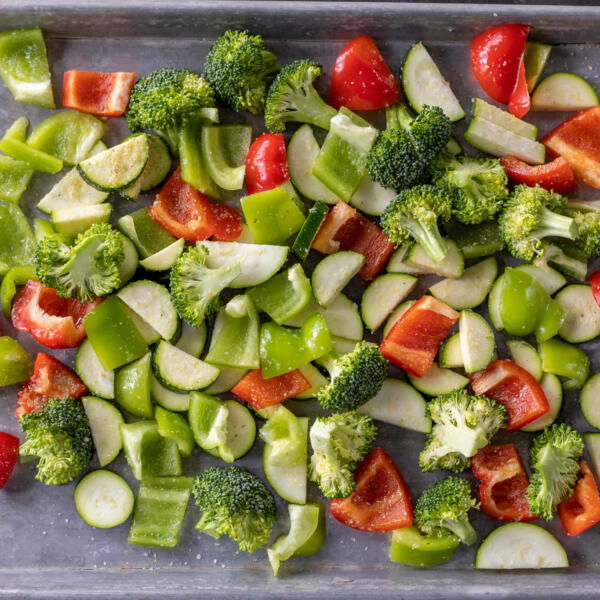 Seasoned veggies on a sheetpan.