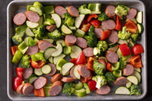 Sheetpan sausage and veggies before baking.