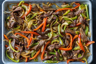 Sheet Pan Steak Fajitas on a pan.