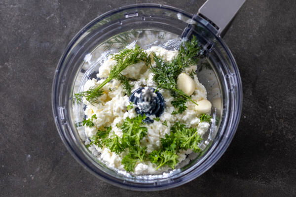 Garlic, cottage cheese, herbs and seasoning in a blender.